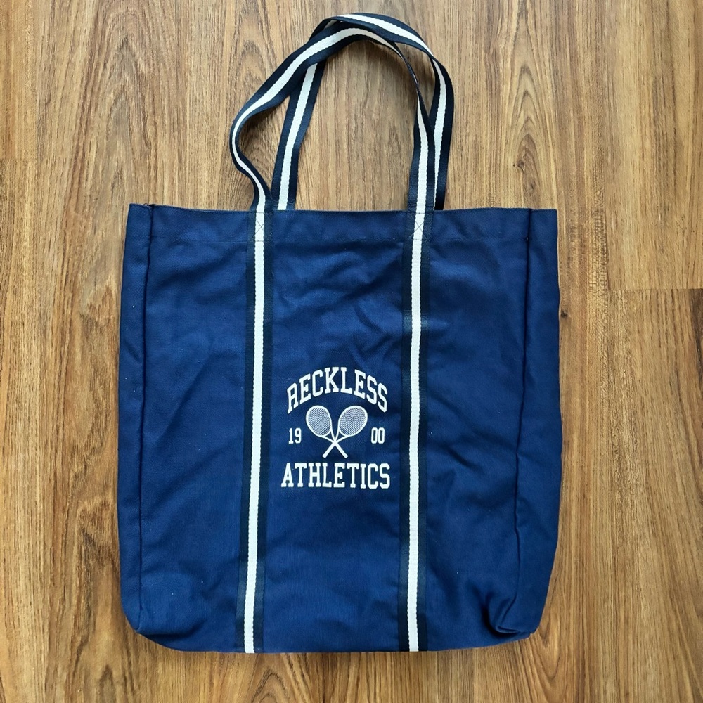 Young & reckless tote bag